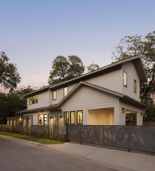 View of front of house with a garage and driveway View of front of house with a garage and driveway