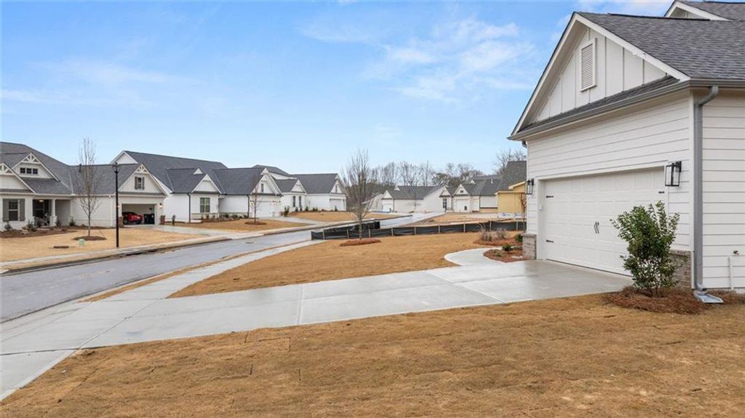Front exterior of a new home in Soleil Belmont Park, Canton, GA, highlighting curb appeal (Image 25).