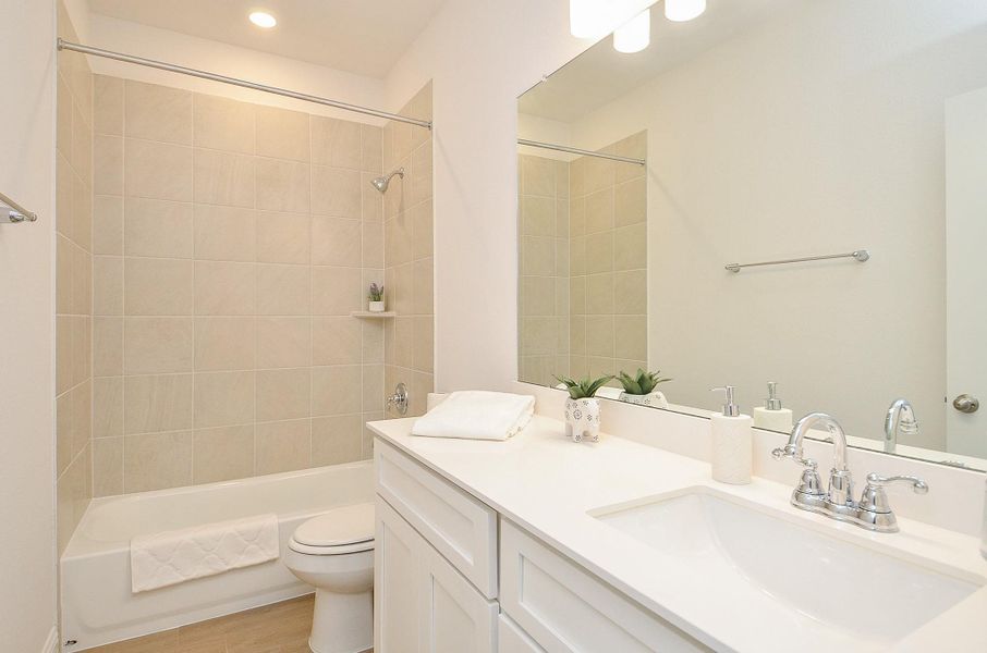Secondary Full Bathroom with tub and shower.
