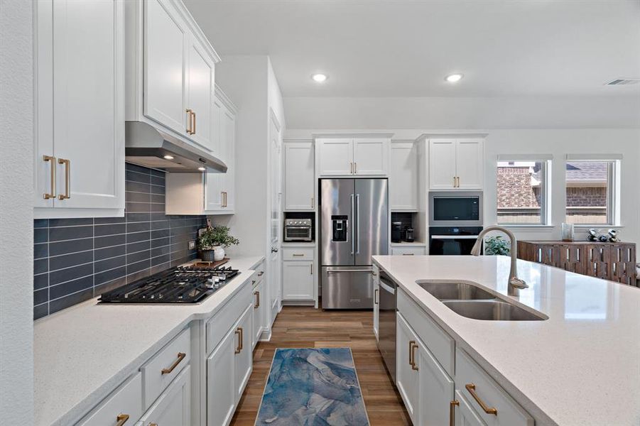 Gas cooktop, beautiful backsplash, a place for your air fryer and coffee bar are features you will appreciate. Gas cooktop, beautiful backsplash, a place for your air fryer and coffee bar are features you will appreciate.