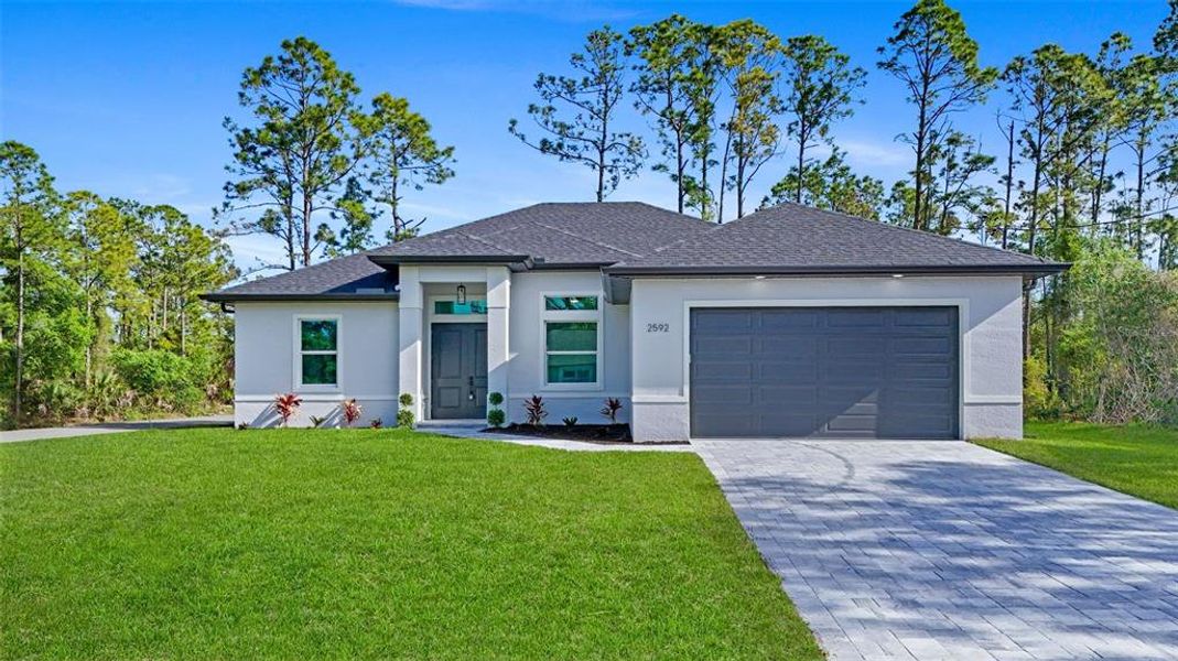 Front exterior of a new home in , North Port, FL, highlighting curb appeal (Image 21).