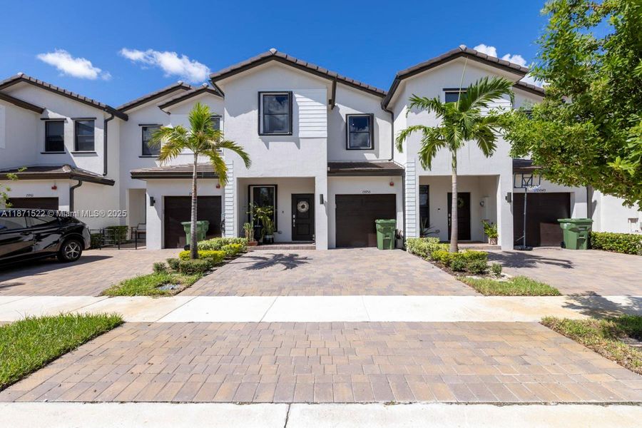 Front exterior of a new home in , Pembroke Pines, FL, highlighting curb appeal (Image 19).