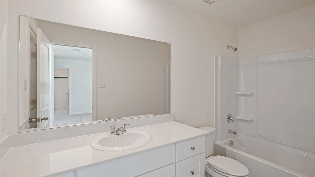 Representative furnished interior of a home built from the Pioneer by Starlight Homes in Avalon Ridge, Cut and Shoot (Image 15).