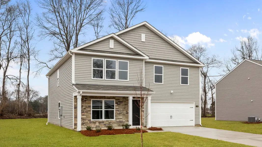 Front exterior of a new home in Blair Ridge, La Grange, NC, highlighting curb appeal (Image 2). Front exterior of a new home in Blair Ridge, La Grange, NC, highlighting curb appeal (Image 2).