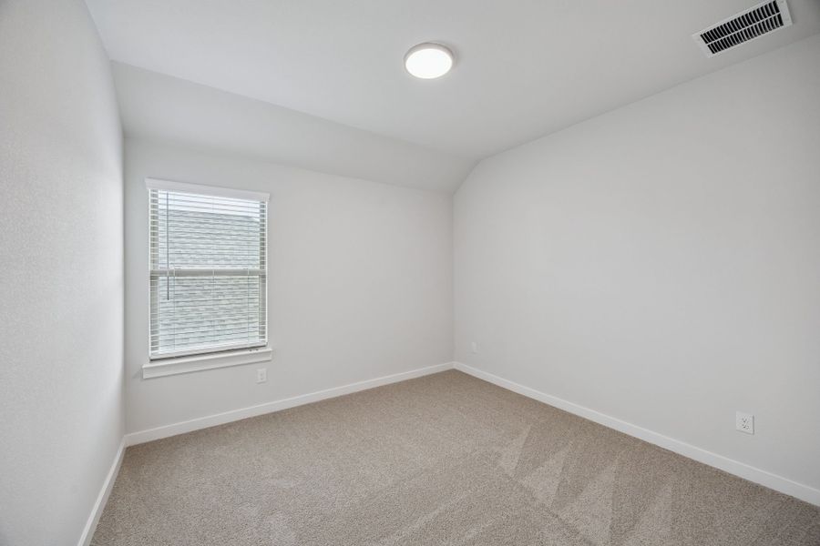 Bedroom in the Masters home plan by Trophy Signature Homes – REPRESENTATIVE PHOTO