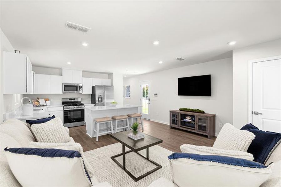 Representative furnished interior of a home built from the Ellis by Ryan Homes in Middle Creek Village Coastal Cottages & Villas, Bolivia (Image 9).