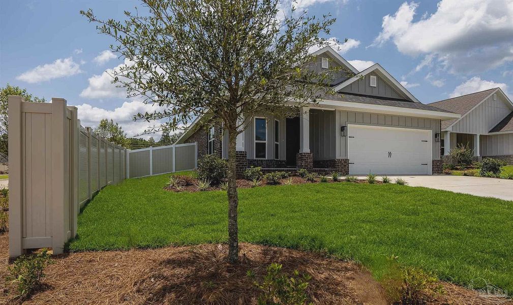 Front exterior of a new home in Parkland Place, Pace, FL, highlighting curb appeal (Image 18).