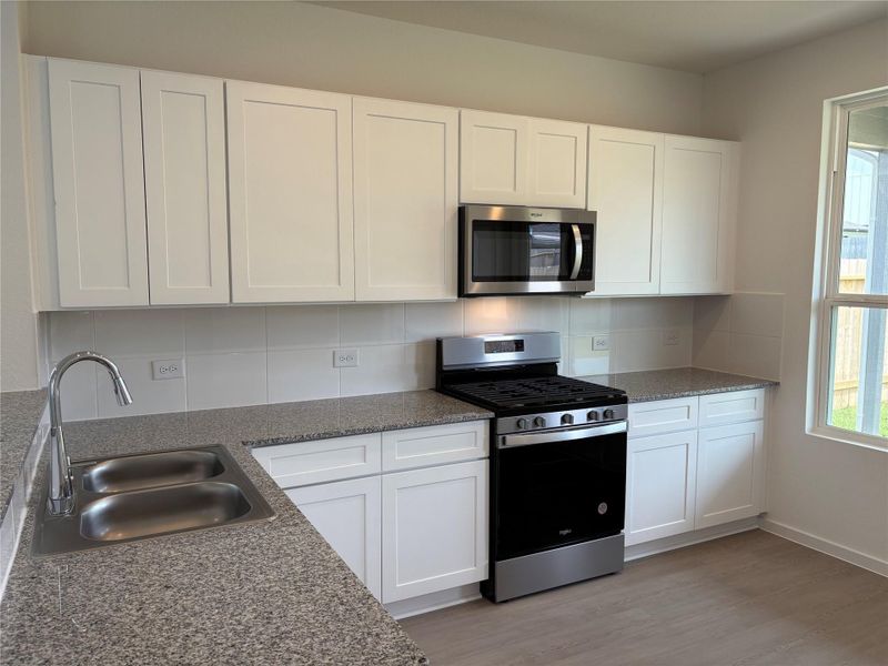 Furnished interior view inside a new home in Decker Farms, Magnolia (Image 2).