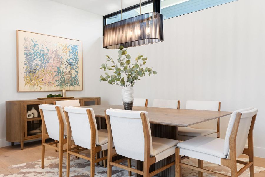 Dining space with wood finished floors