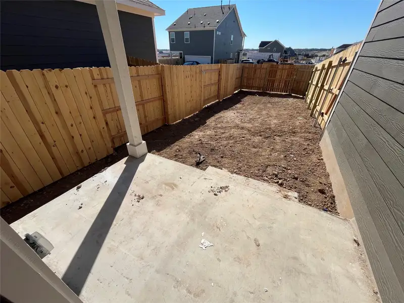 Exterior details and patio area of a home in The Cottages at Lariat, Liberty Hill (Image 3).