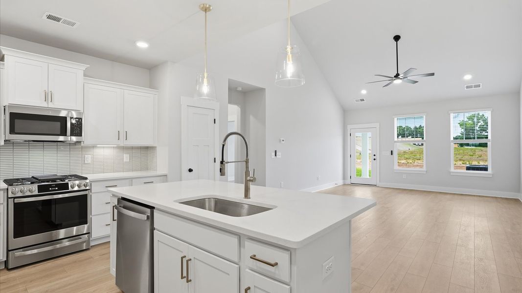 First-rate kitchen with functional layout, designer pendant lighting, and a center island at the Silo Ridge community First-rate kitchen with functional layout, designer pendant lighting, and a center island at the Silo Ridge community
