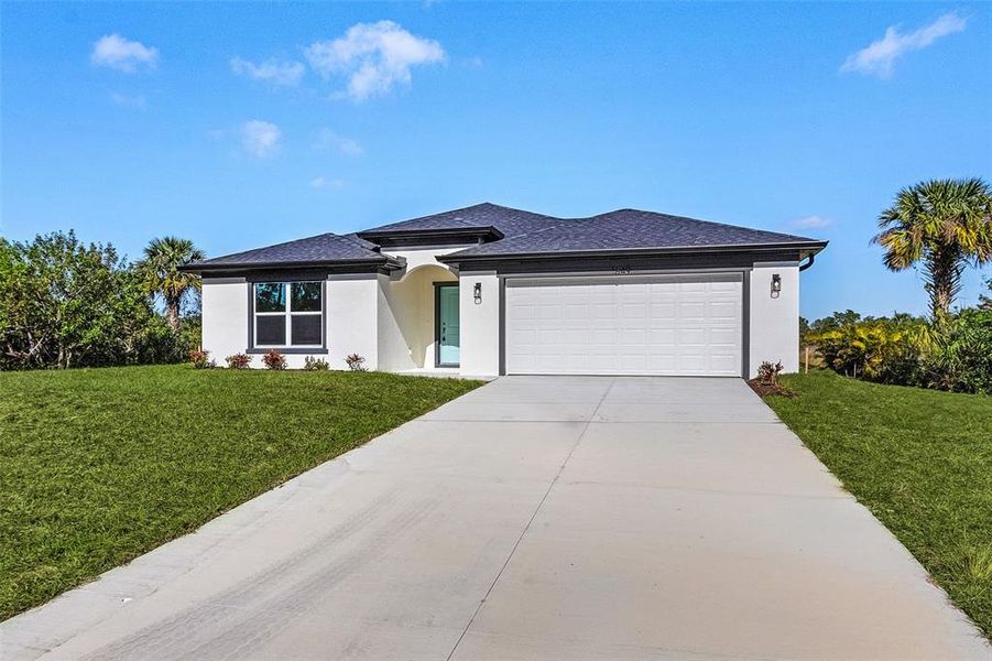 Front exterior of a new home in , North Port, FL, highlighting curb appeal (Image 17). Front exterior of a new home in , North Port, FL, highlighting curb appeal (Image 17).