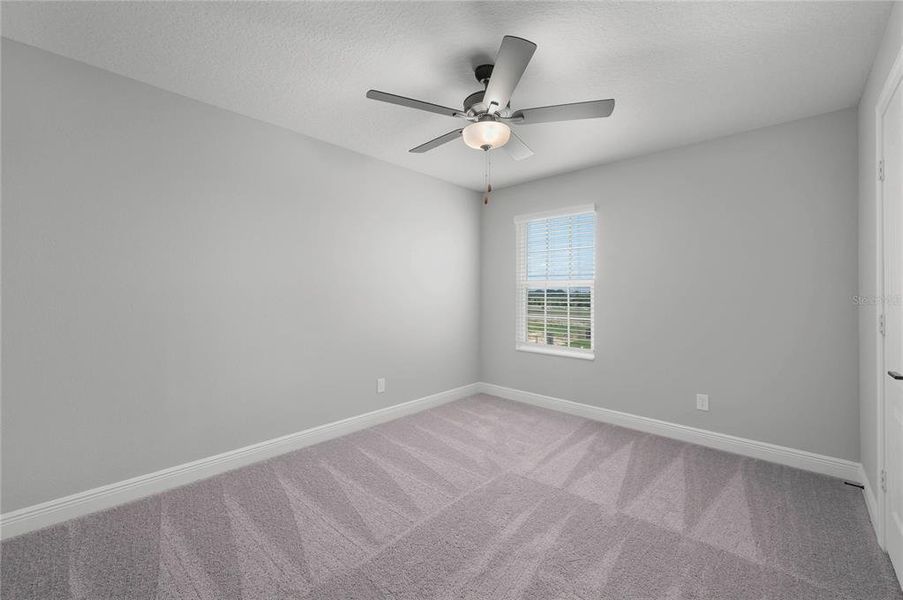 Spacious, unfurnished interior of a new home in Gum Lake Preserve, Lake Alfred (Image 34).