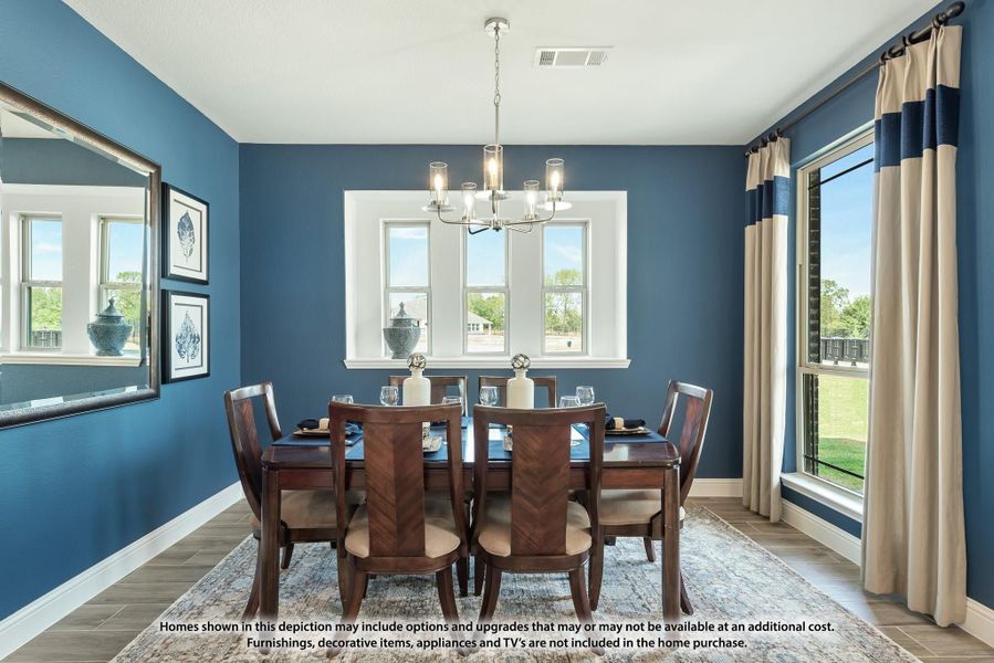 Formal dining room with dark wood table, six chairs, chandelier, and blue accent walls Formal dining room with dark wood table, six chairs, chandelier, and blue accent walls