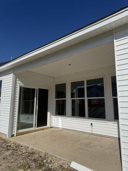 Front exterior of a new home in Oakley Pointe, Moncks Corner, SC, highlighting curb appeal (Image 2).