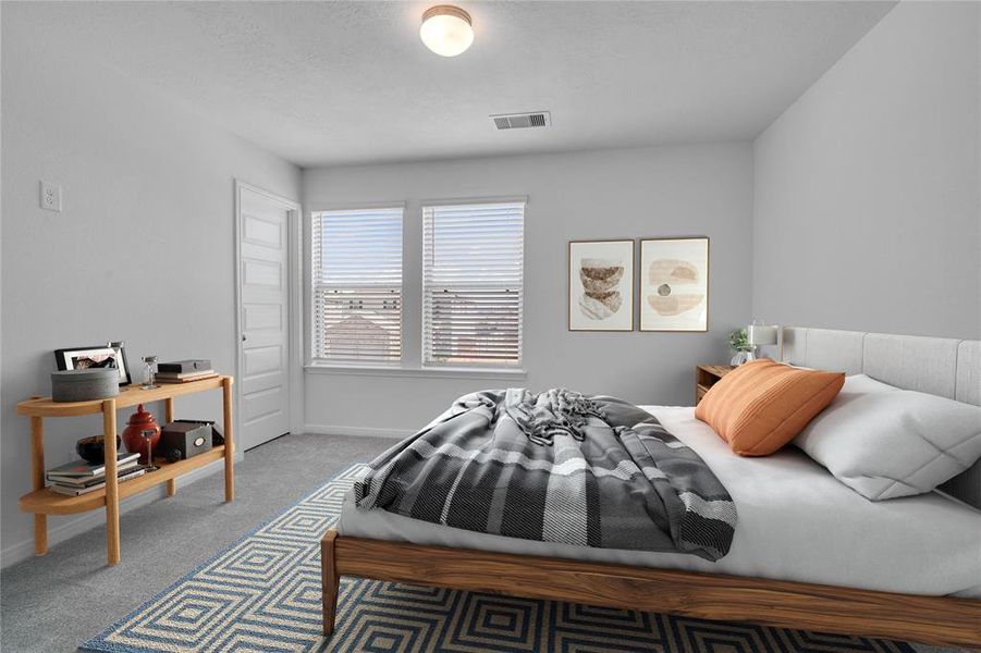 Secondary bedroom features plush carpet, neutral paint, lighting, large window with privacy blinds and ample sized closet space.