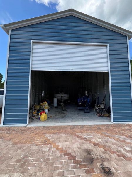 Front exterior of a new home in , Palm Bay, FL, highlighting curb appeal (Image 25).