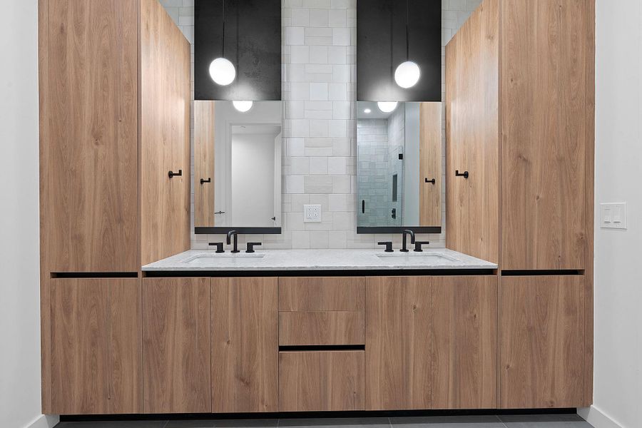 Full bath with double vanity, backsplash, and tile patterned floors