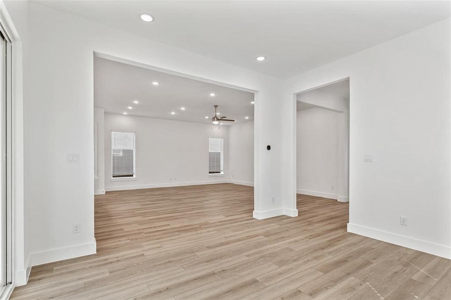 Spare room featuring recessed lighting, light wood-style flooring, and a ceiling fan