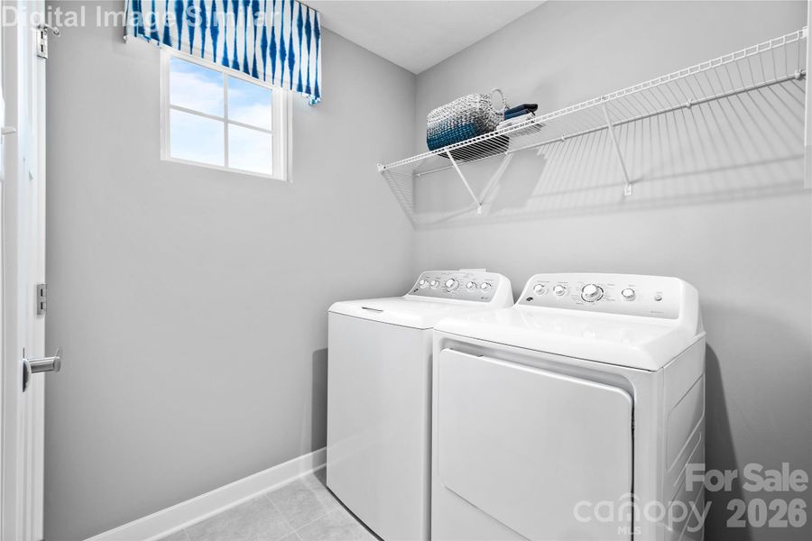 Walk-in laundry room with a bright window, built-in shelving for detergents and towels—just toss in a load and close the door for quiet convenience. Walk-in laundry room with a bright window, built-in shelving for detergents and towels—just toss in a load and close the door for quiet convenience.