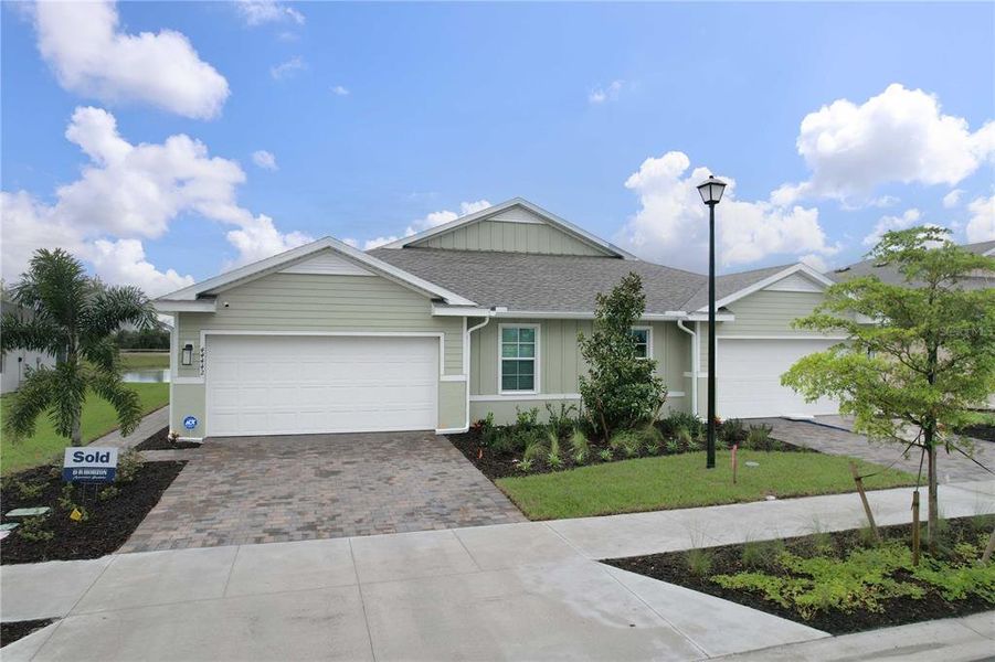 Front exterior of a new home in , Punta Gorda, FL, highlighting curb appeal (Image 21).
