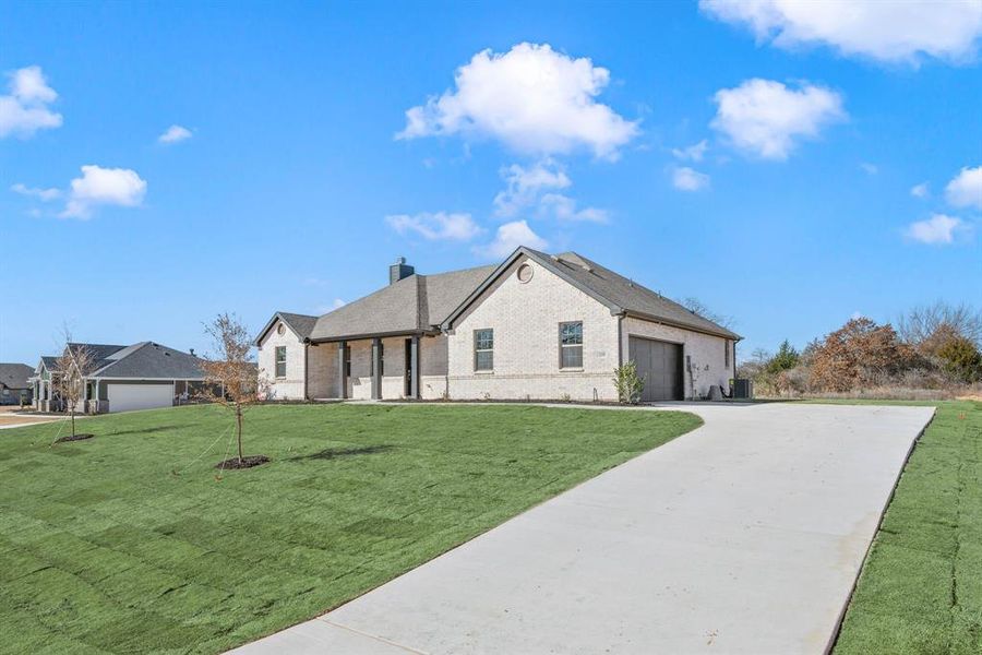 Front exterior of a new home in Saddleback Estates, Boyd, TX, highlighting curb appeal (Image 23).