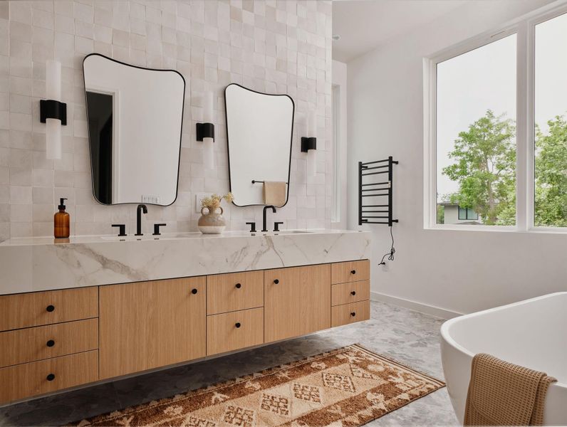 Floating dual vanity with wood-finish cabinetry, stone countertop, and integrated sinks