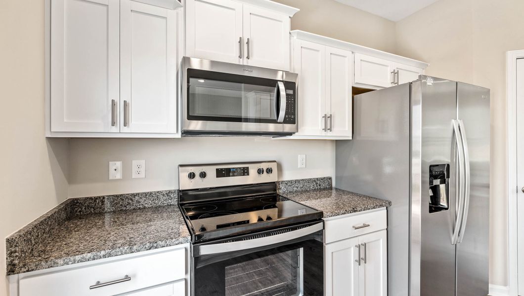 Furnished interior view inside a new home in Tanglewood Townes, Greenville (Image 13).