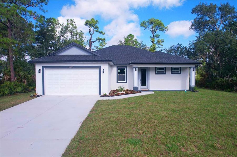Front exterior of a new home in , Port Charlotte, FL, highlighting curb appeal (Image 20).