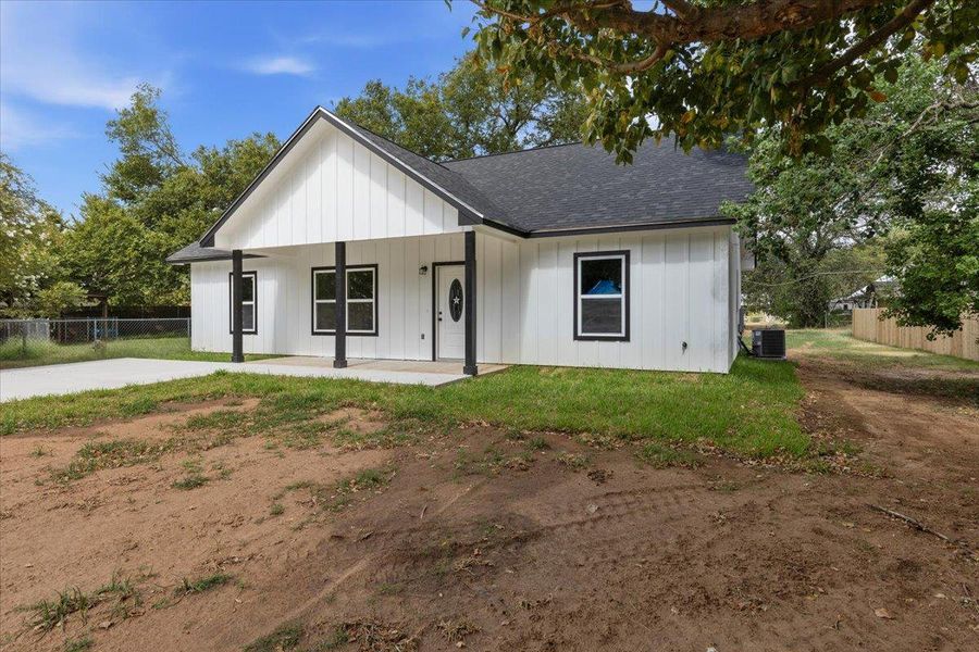 Crisp board and batten siding meets a classic gabled roofline on this modern farmhouse. Crisp board and batten siding meets a classic gabled roofline on this modern farmhouse.