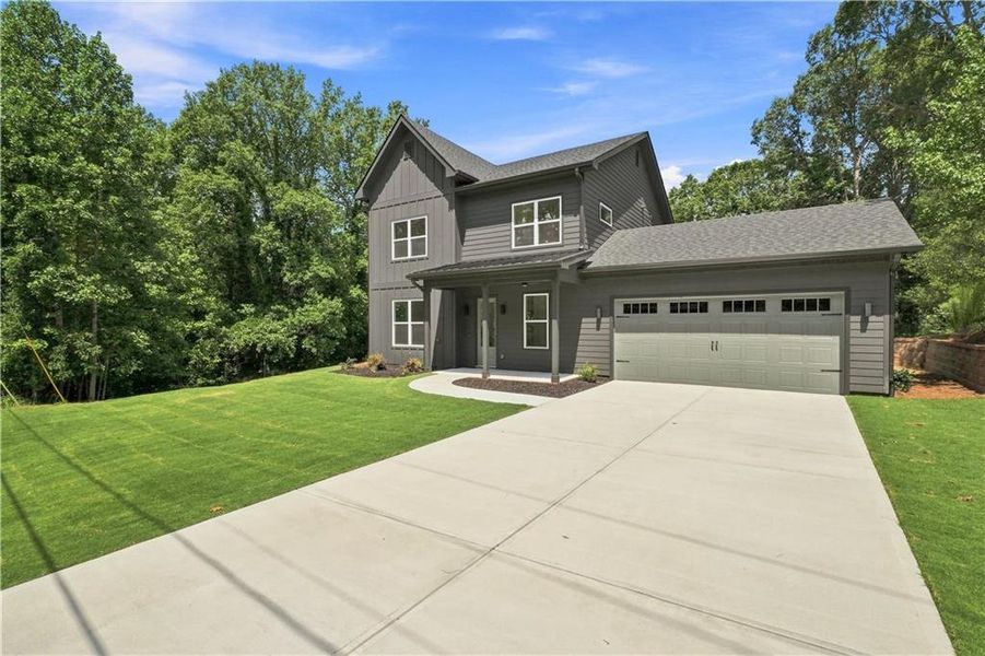 Front exterior of a new home in , Gainesville, GA, highlighting curb appeal (Image 2). Front exterior of a new home in , Gainesville, GA, highlighting curb appeal (Image 2).