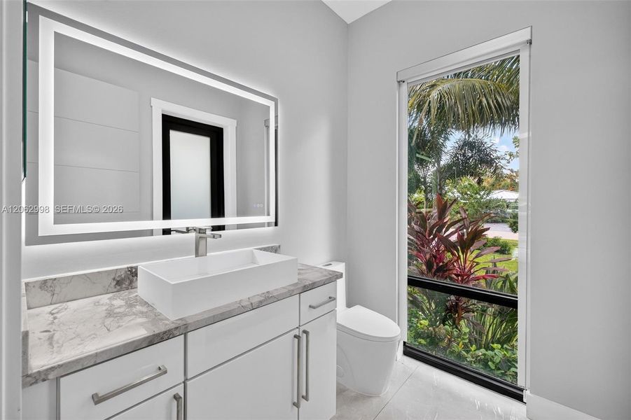 Downstairs guest bathroom / cabana bathroom, privately located by foyer. Also accessible via side door