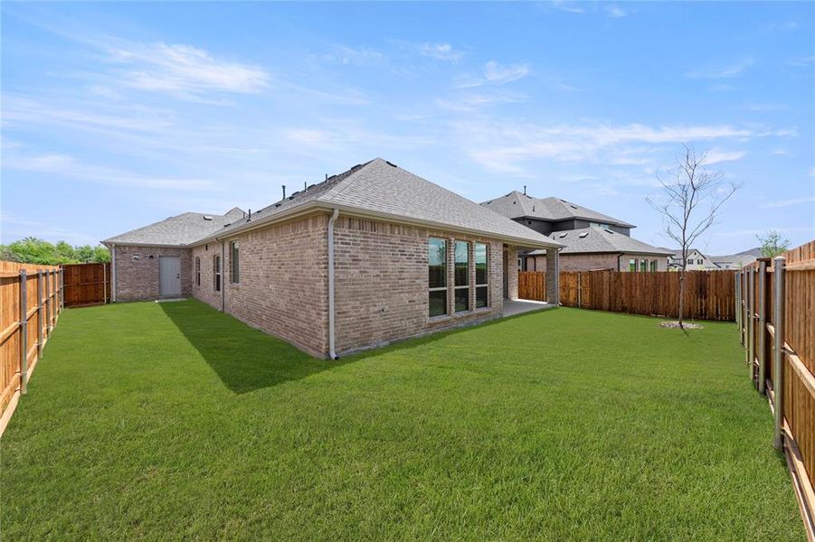 Front exterior of a new home in Valencia on The Lake, Little Elm, TX, highlighting curb appeal (Image 26). Front exterior of a new home in Valencia on The Lake, Little Elm, TX, highlighting curb appeal (Image 26).
