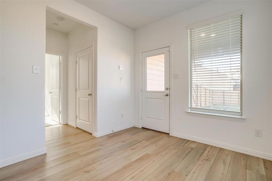 Foyer entrance featuring light hardwood / wood-style floors