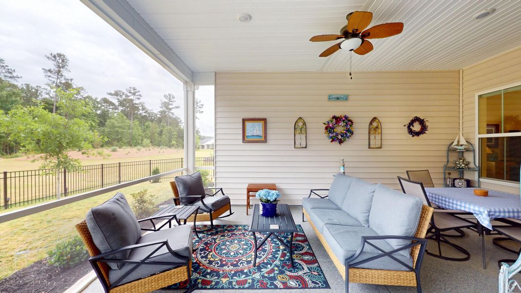 Exterior details and patio area of a home in Summerwind Crossing at Lakes of Cane Bay, Summerville (Image 27).