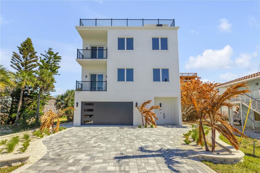 Front exterior of a new home in , New Smyrna Beach, FL, highlighting curb appeal (Image 26). Front exterior of a new home in , New Smyrna Beach, FL, highlighting curb appeal (Image 26).