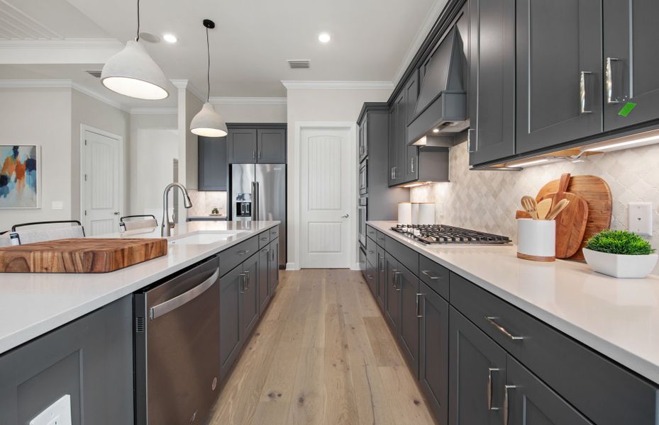 Designer finishes, stainless steel appliances and stylish kitchen backsplash Designer finishes, stainless steel appliances and stylish kitchen backsplash