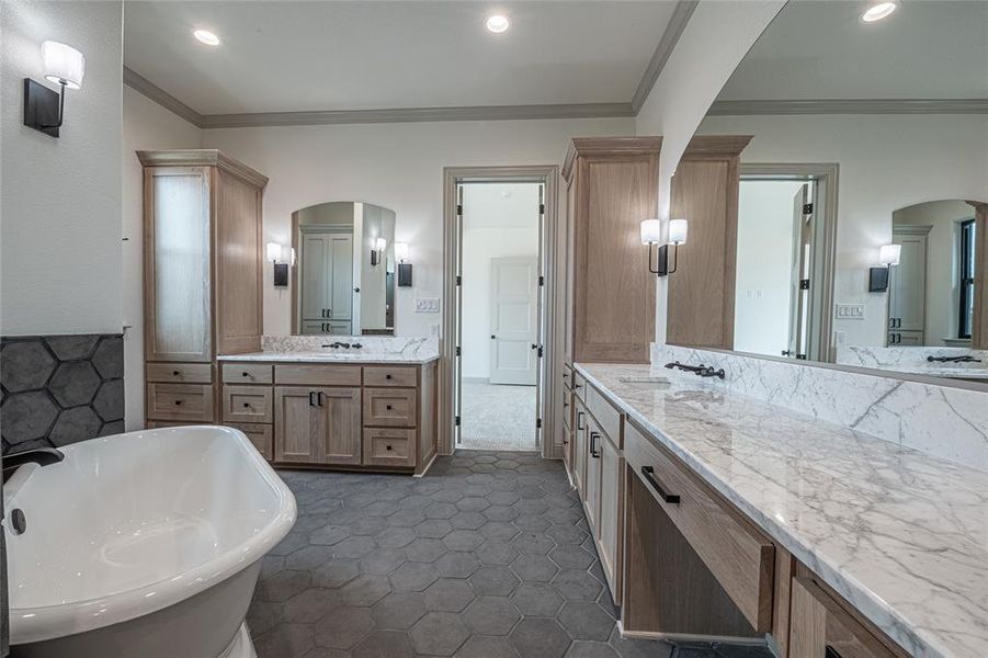 Full bath with crown molding, two vanities, a soaking tub, and recessed lighting Full bath with crown molding, two vanities, a soaking tub, and recessed lighting