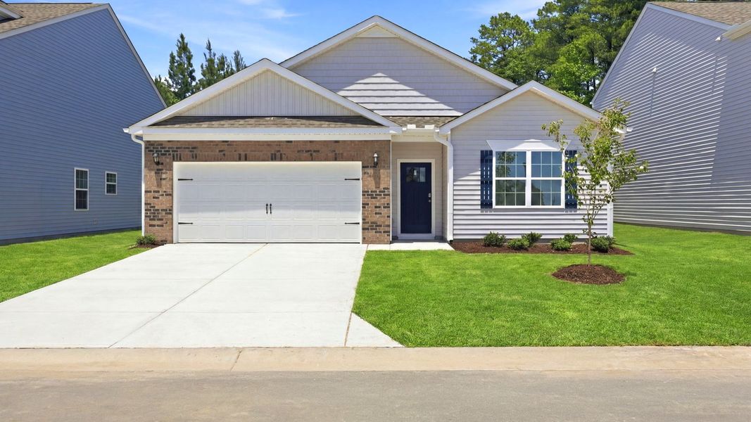 Front exterior of a new home in Ridgewood Farms, Winterville, NC, highlighting curb appeal (Image 17). Front exterior of a new home in Ridgewood Farms, Winterville, NC, highlighting curb appeal (Image 17).