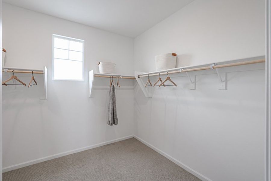 A white room with a white wall and a white chair. A white room with a white wall and a white chair.