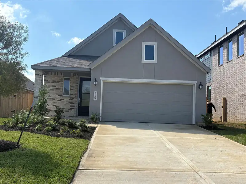 Front exterior of a new home in The Grand Prairie: Avante Collection, Hockley, TX, highlighting curb appeal (Image 1).