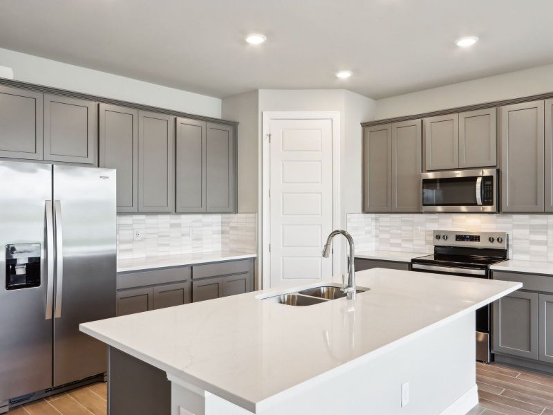 Kitchen in the Dove floorplan at 44331 Frontier Dr