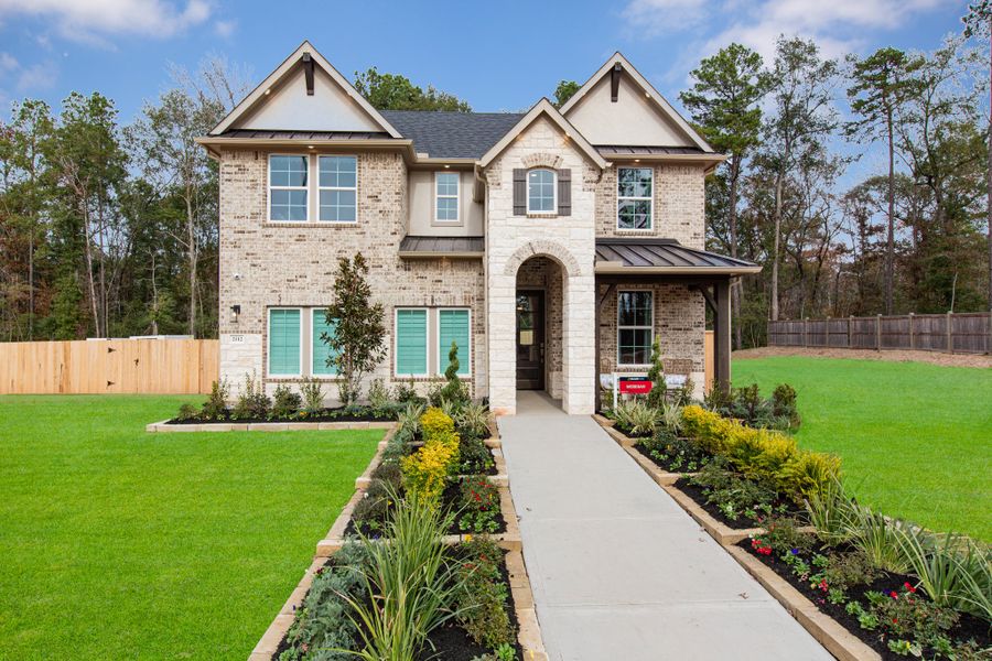 Front exterior of a new home in Madeley Creek, Conroe, TX, highlighting curb appeal (Image 1). Front exterior of a new home in Madeley Creek, Conroe, TX, highlighting curb appeal (Image 1).
