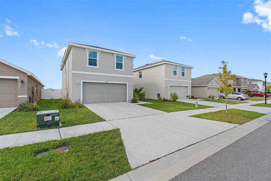 Front exterior of a new home in , Ruskin, FL, highlighting curb appeal (Image 25). Front exterior of a new home in , Ruskin, FL, highlighting curb appeal (Image 25).