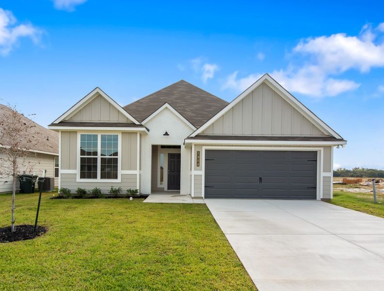 Front exterior of a new home in Grand Lake, Snook, TX, highlighting curb appeal (Image 1). Front exterior of a new home in Grand Lake, Snook, TX, highlighting curb appeal (Image 1).
