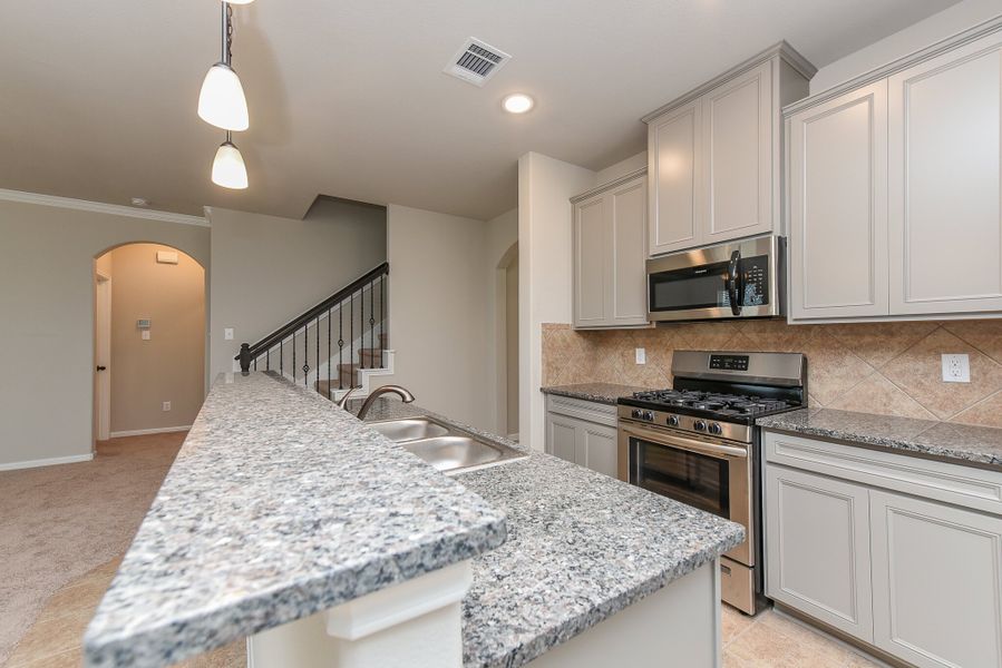 Representative furnished interior of a home built from the Floor Plan 2201 by Colina Homes in Grand Magnolia, Magnolia (Image 8).