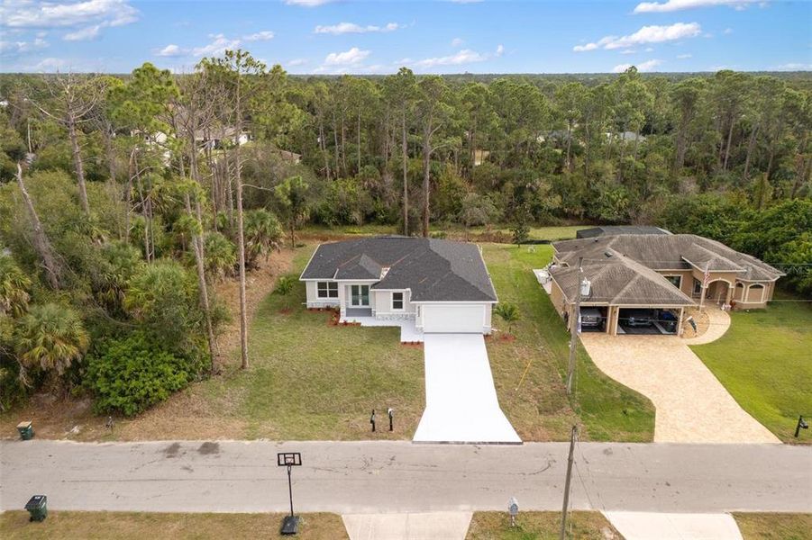 Front exterior of a new home in , North Port, FL, highlighting curb appeal (Image 20). Front exterior of a new home in , North Port, FL, highlighting curb appeal (Image 20).