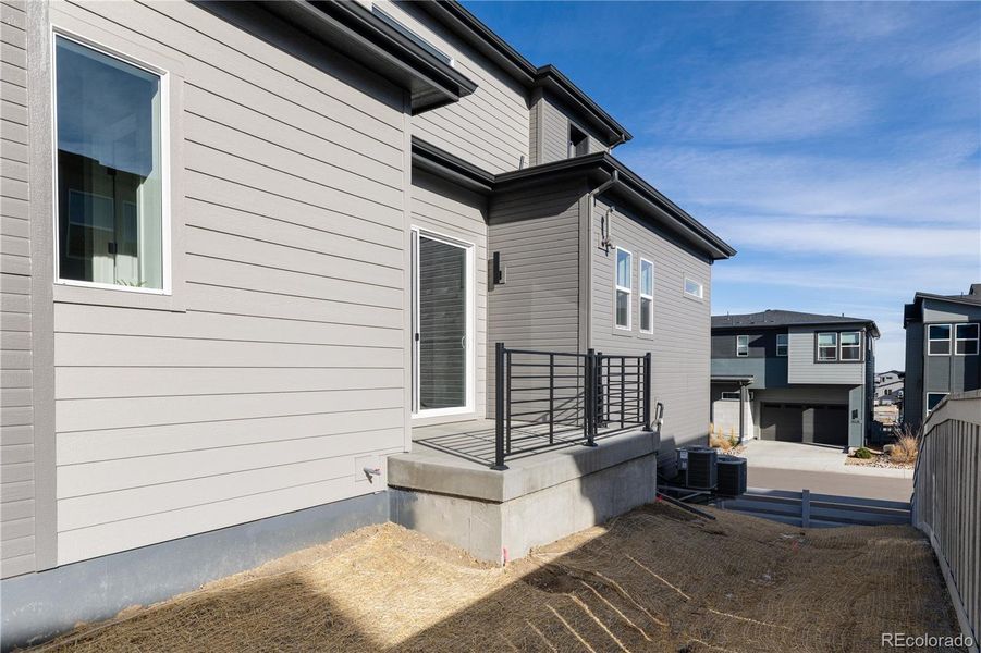 Exterior details and patio area of a home in Lyric at Ridgegate, Lone Tree (Image 2).
