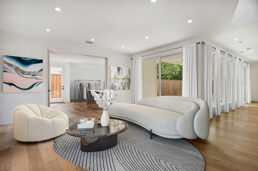 An elegant living area with views to the backyard and entry courtyard.