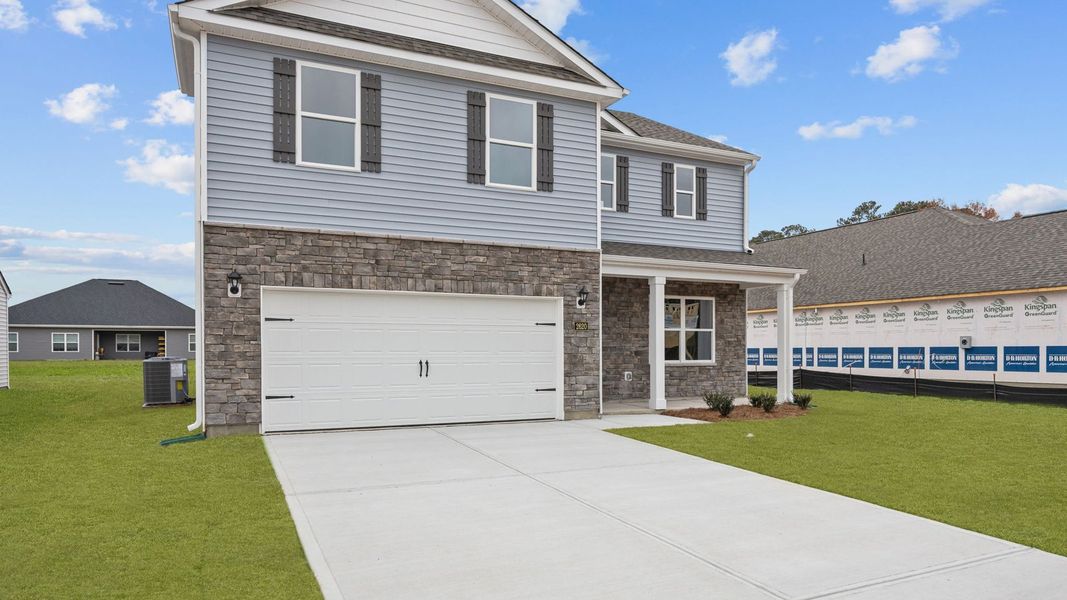 Front exterior of a new home in Villa Grande, Winterville, NC, highlighting curb appeal (Image 2).